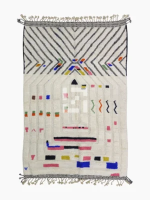 Top View of Suzan handmade Beni Ourain wool rug with a bold chevron and abstract raised maze design in black and multicolor on an ivory background