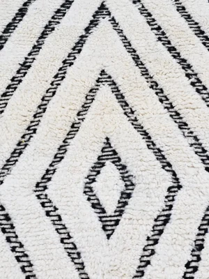 Detailed View of Suzan handmade Beni Ourain wool runner with a trellis and textured high-low pile design in black and ivory