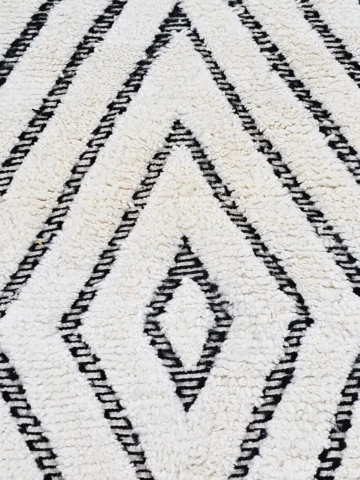 Detailed View of Suzan handmade Beni Ourain wool runner with a trellis and textured high-low pile design in black and ivory