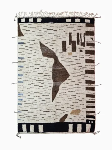 Top View of Talia handmade Beni Ourain wool rug with a textured plush design in cloud ivory, black, and brown