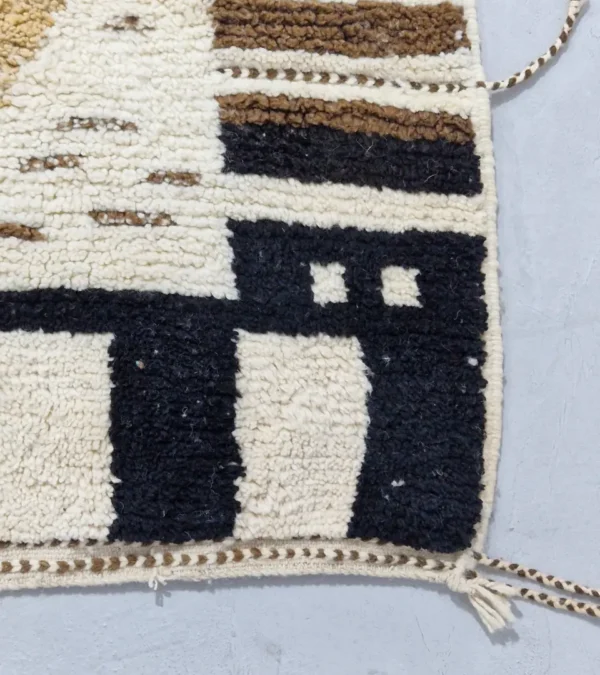 Detailed View of Talia handmade Beni Ourain wool rug with a textured plush design in cloud ivory, black, and brown