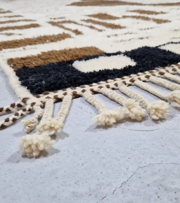 Detailed View of Talia handmade Beni Ourain wool rug with a textured plush design in cloud ivory, black, and brown
