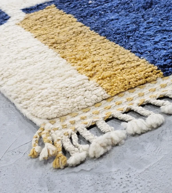 Detailed View Of Tareen handmade Beni Ourain wool runner with a colorful lines design in brown, teal-blue, dusty blue, mustard yellow, and ivory