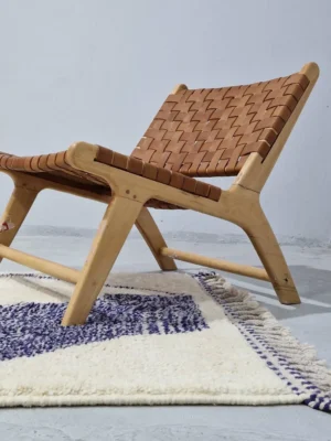 Toda handmade Beni Ourain wool rug with a modern organic abstract design in blue and beige in room