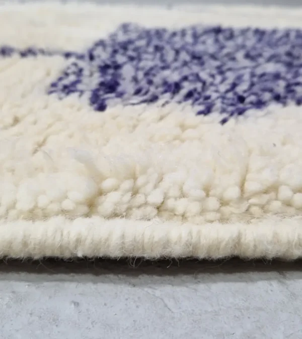 Zoomed In View of Toda handmade Beni Ourain wool rug with a modern organic abstract design in blue and beige