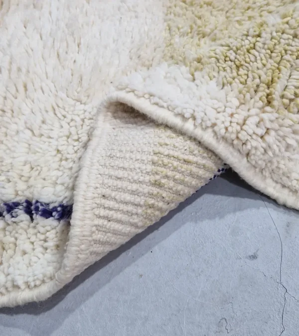Detailed View of Toda handmade Beni Ourain wool rug with a modern organic abstract design in blue and beige