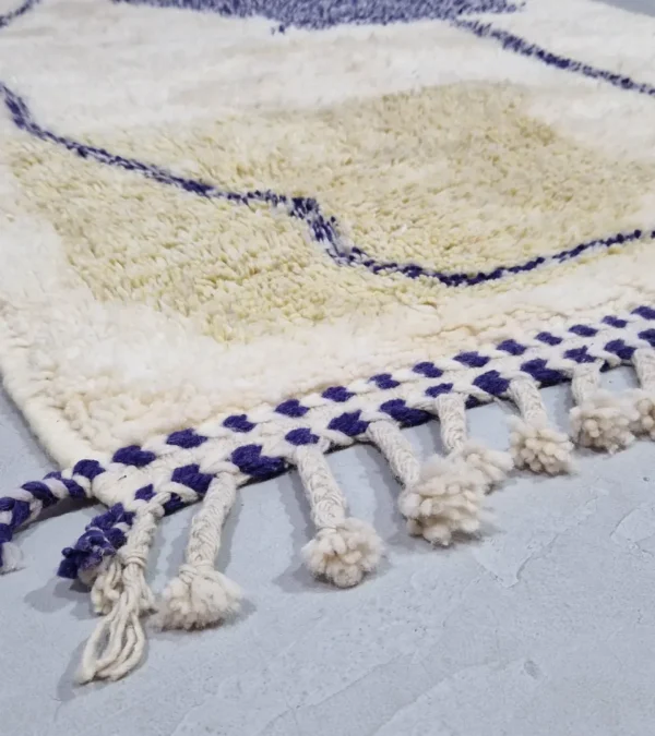 Detailed View of Toda handmade Beni Ourain wool rug with a modern organic abstract design in blue and beige