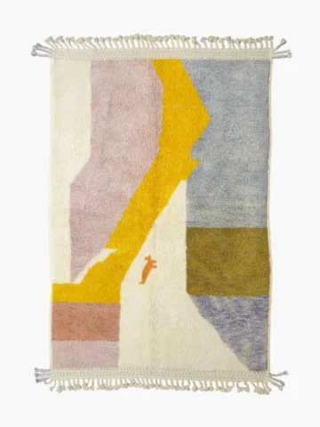 Top View of Handmade Moroccan plush wool rug with a modern cloud-like abstract design in muted pink, yellow, and gray