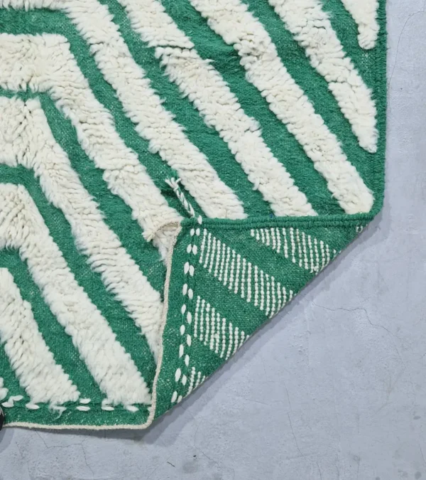 Detailed View of Verdant handmade Beni Ourain wool rug with a bold pattern of nested green and ivory stripes