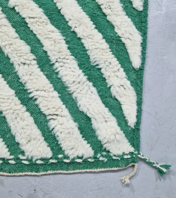 Detailed View of Verdant handmade Beni Ourain wool rug with a bold pattern of nested green and ivory stripes