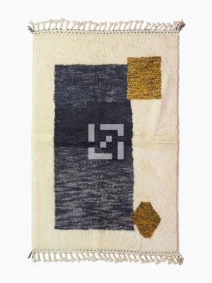 Top View of Yara handmade Beni Ourain wool rug with a modern geometric pattern and tassel fringe in charcoal gray, mustard yellow-brown, and ivory