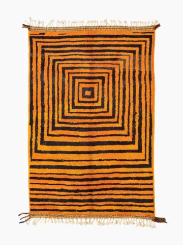 Top View of Handmade Moroccan wool rug with orange and navy concentric square stripes