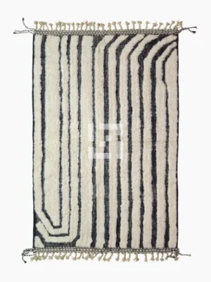 Top View of Zebra handmade Beni Ourain wool rug with a bold black and white striped pattern and varying pile height