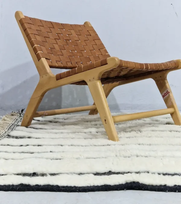 Zebra handmade Beni Ourain wool rug with a bold black and white striped pattern and varying pile height in room