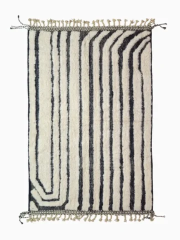 Top View of Zebra handmade Beni Ourain wool rug with a bold black and white striped pattern and varying pile height