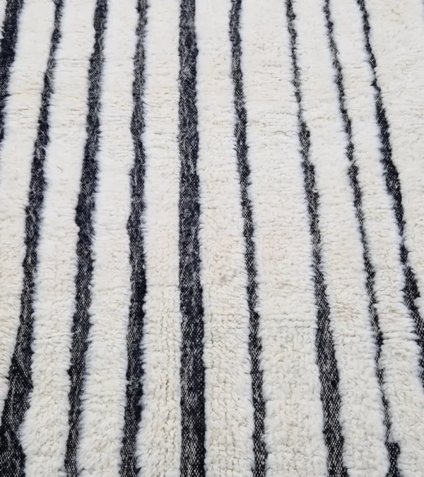 Detailed View of Zebra handmade Beni Ourain wool rug with a bold black and white striped pattern and varying pile height