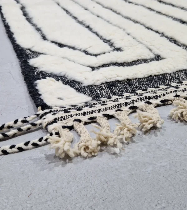 Detailed View of Zebra handmade Beni Ourain wool rug with a bold black and white striped pattern and varying pile height