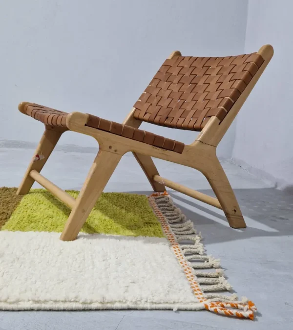 Zera handmade Beni Ourain wool rug with a contemporary abstract design in multicolor hues of green, orange, and brown in room
