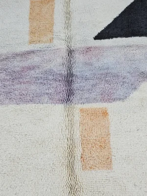 Detailed View of Zira handmade Moroccan wool rug with a minimalist geometric blocks design in black, lavender, and beige