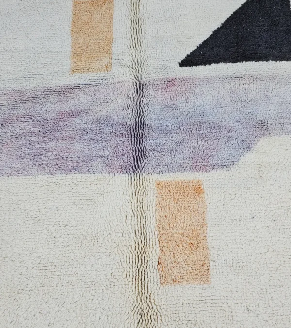 Detailed View of Zira handmade Moroccan wool rug with a minimalist geometric blocks design in black, lavender, and beige