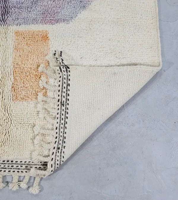 Detailed View of Zira handmade Moroccan wool rug with a minimalist geometric blocks design in black, lavender, and beige