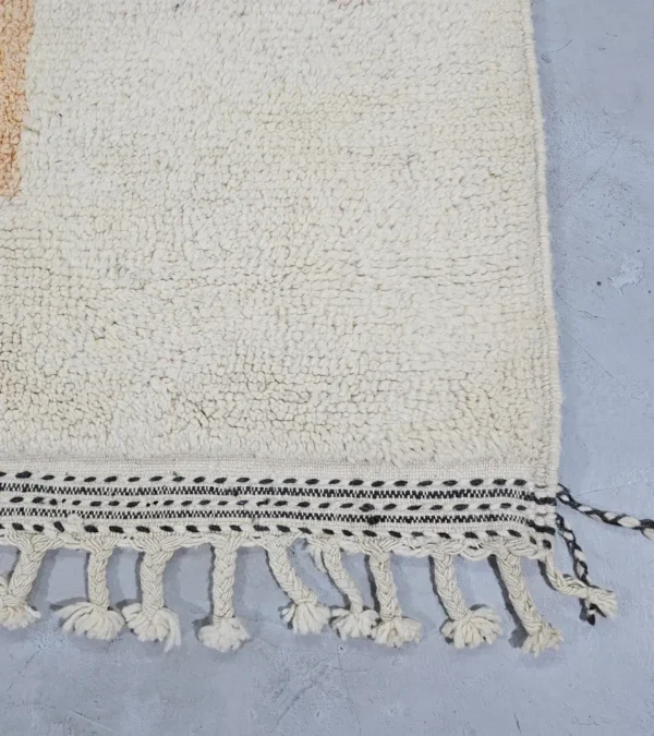 Detailed View of Zira handmade Moroccan wool rug with a minimalist geometric blocks design in black, lavender, and beige