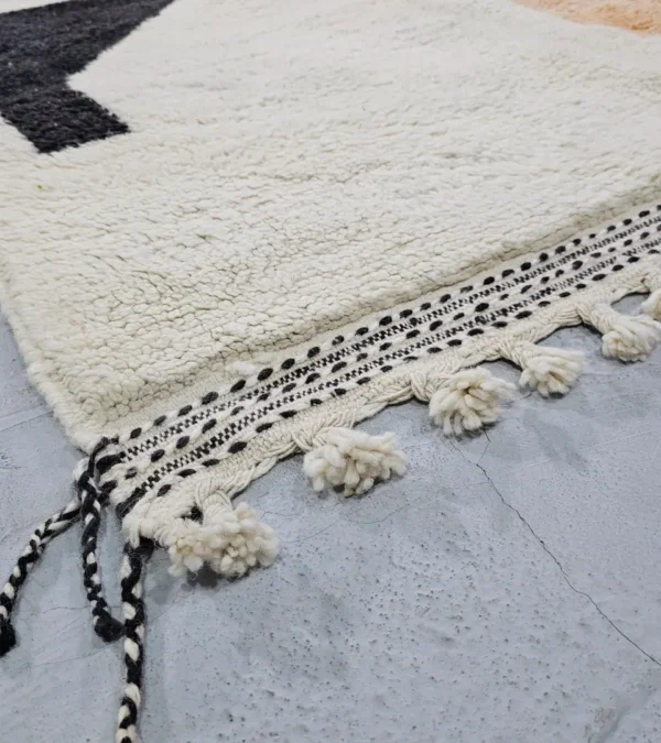 Detailed View of Zira handmade Moroccan wool rug with a minimalist geometric blocks design in black, lavender, and beige