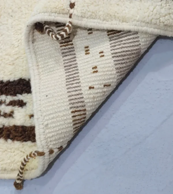 Detailed View of Zira handmade Beni Ourain wool rug with a textured geometric design in brown, gray, and ivory