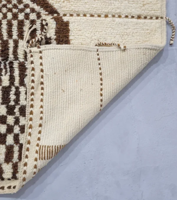 Detailed View of Zira handmade Beni Ourain wool rug with a textured geometric design in brown, gray, and ivory