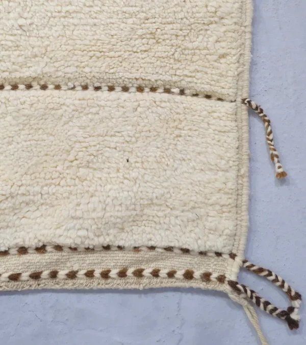 Detailed View of Zira handmade Beni Ourain wool rug with a textured geometric design in brown, gray, and ivory