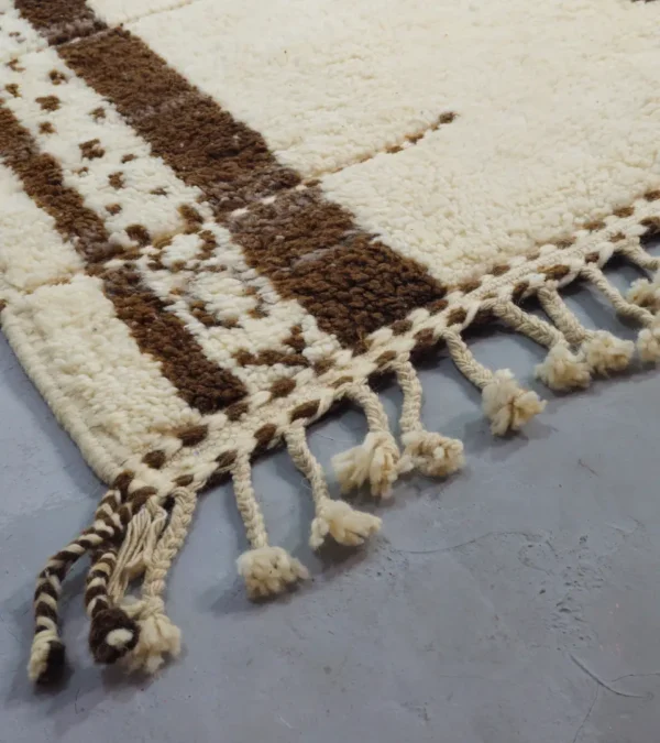 Detailed View of Zira handmade Beni Ourain wool rug with a textured geometric design in brown, gray, and ivory
