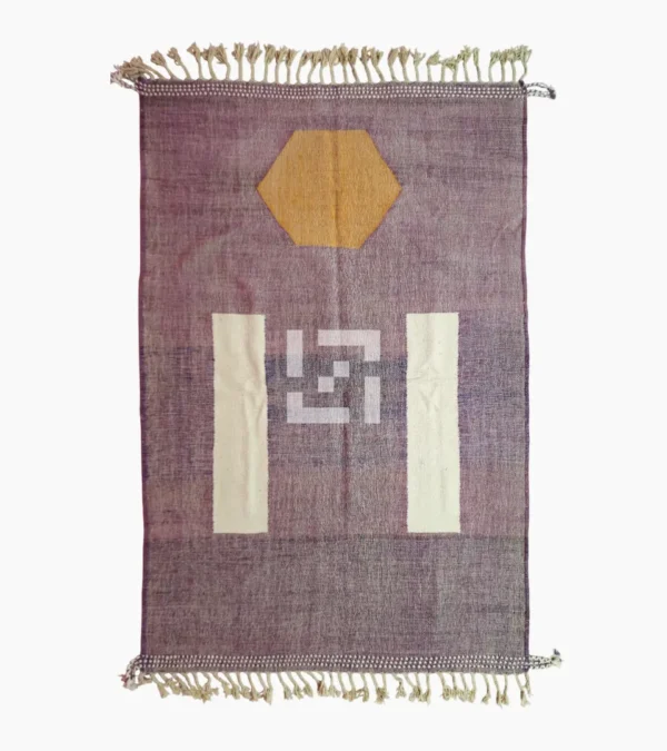 Top View of Zola handmade Kilim flatweave wool rug with a purple background and white and yellow geometric shapes