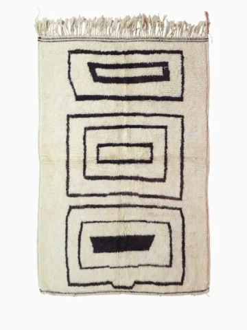 Top View of Zola handmade Beni Ourain wool rug with a minimalist design of bold black lines on an ivory background