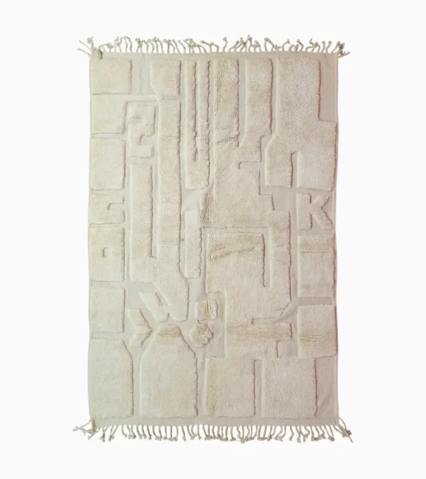 Top View of Zuri handmade Beni Ourain wool rug with an abstract high-low pile design on a neutral ivory background