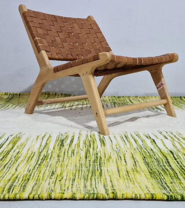 Zuri handmade Moroccan Kilim rug with a modern striped design in green, yellow, and ivory in room