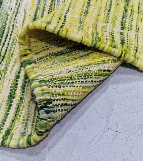 Detailed View of Zuri handmade Moroccan Kilim rug with a modern striped design in green, yellow, and ivory