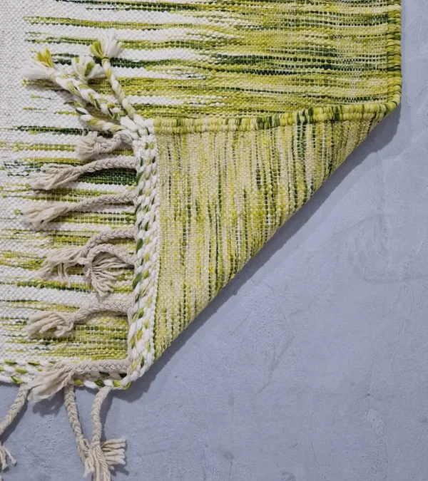 Detailed View of Zuri handmade Moroccan Kilim rug with a modern striped design in green, yellow, and ivory