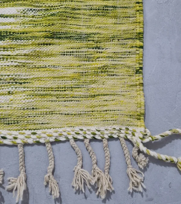 Detailed View of Zuri handmade Moroccan Kilim rug with a modern striped design in green, yellow, and ivory