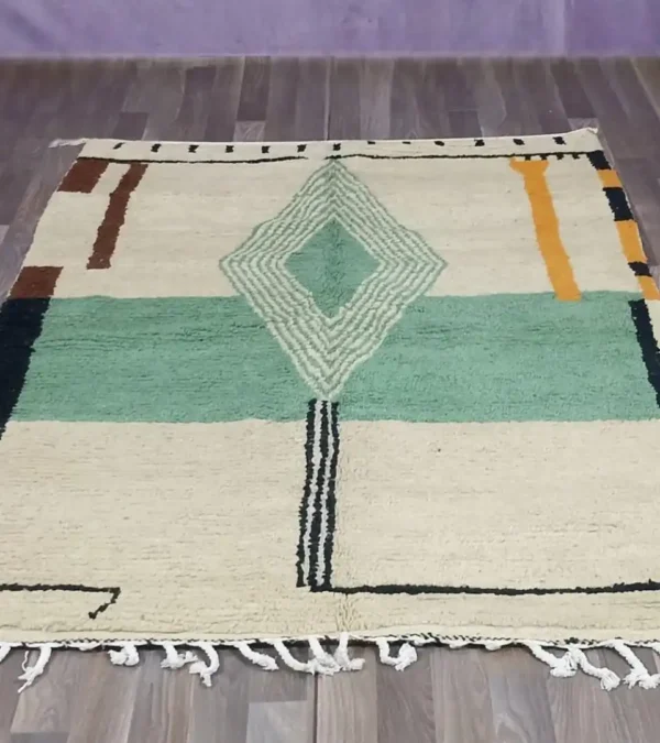 Handmade Moroccan rug with modern geometric diamond design in green, beige, rust, and mustard – Jaadzana