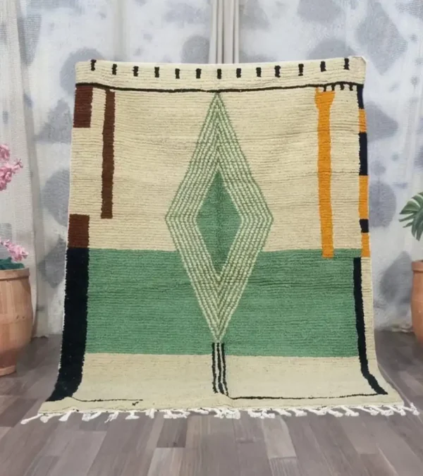 Handmade Moroccan rug with modern geometric diamond design in green, beige, rust, and mustard – Jaadzana