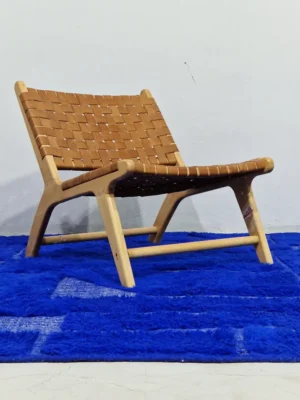 Handmade Moroccan wool rug in a vibrant blue with a subtle geometric pattern created by varied pile height in room