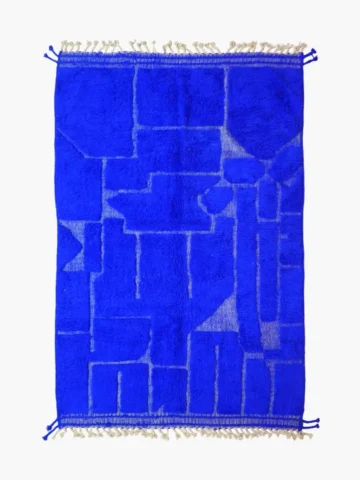 top view of Handmade Moroccan wool rug in a vibrant blue with a subtle geometric pattern created by varied pile height