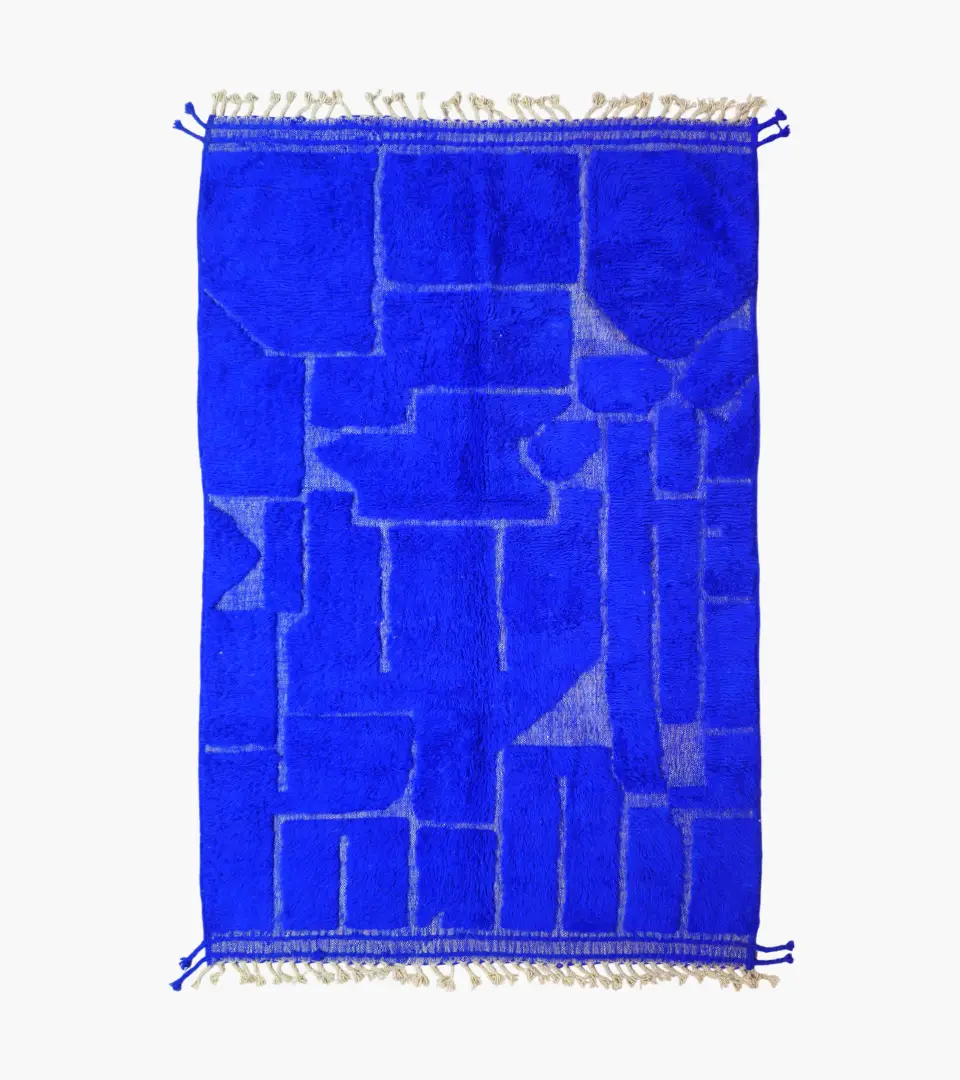 top view of Handmade Moroccan wool rug in a vibrant blue with a subtle geometric pattern created by varied pile height
