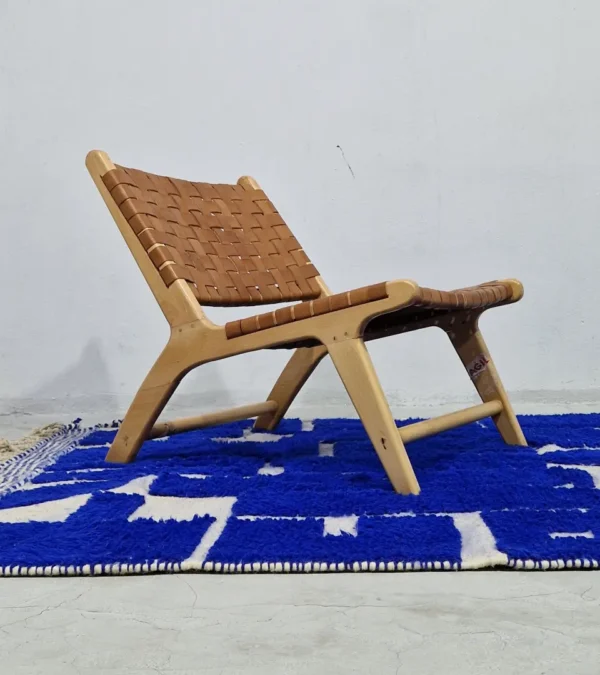 Handwoven cobalt blue abstract geometric Moroccan rug with shaggy pile in room