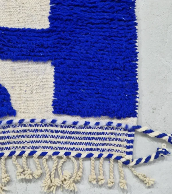 detailed view of Handwoven cobalt blue abstract geometric Moroccan rug with shaggy pile