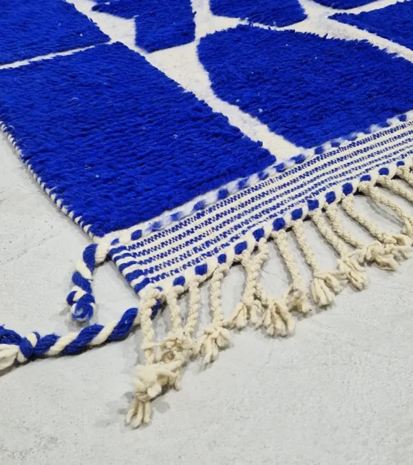 detailed view of Handwoven cobalt blue abstract geometric Moroccan rug with shaggy pile