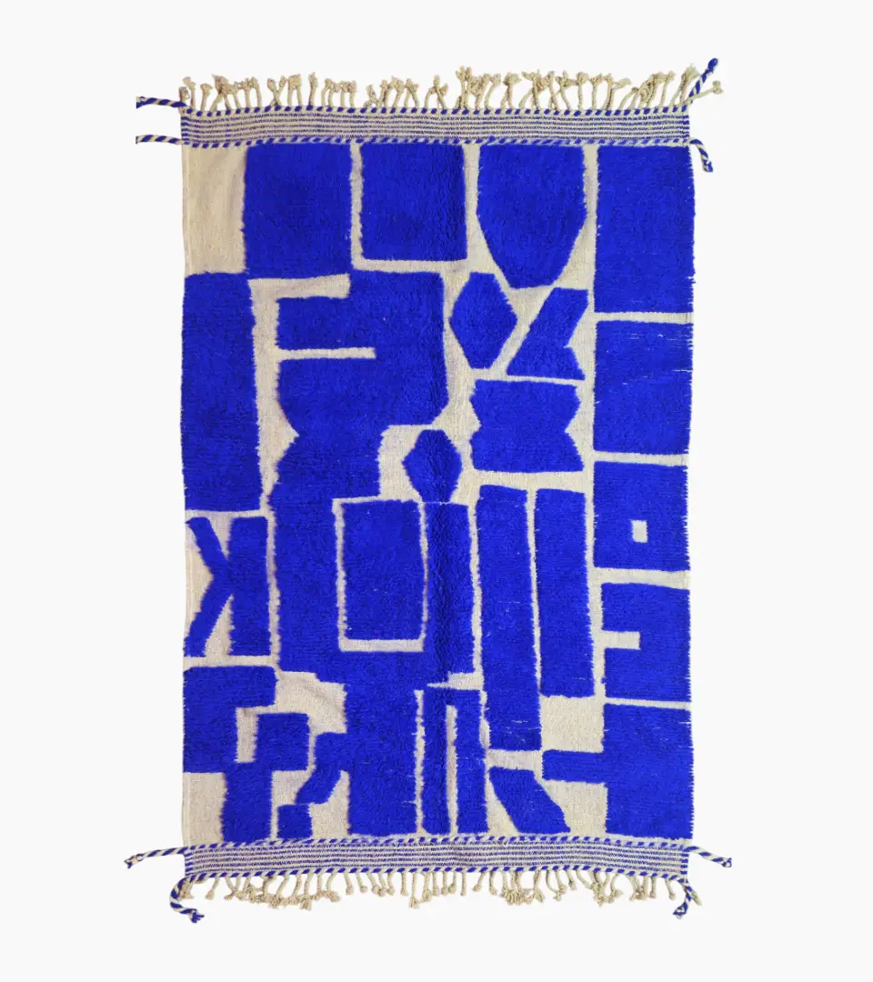 top view of Handwoven cobalt blue abstract geometric Moroccan rug with shaggy pile