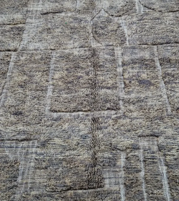detailed view of Handwoven earth gray wool rug with subtle geometric grid pattern