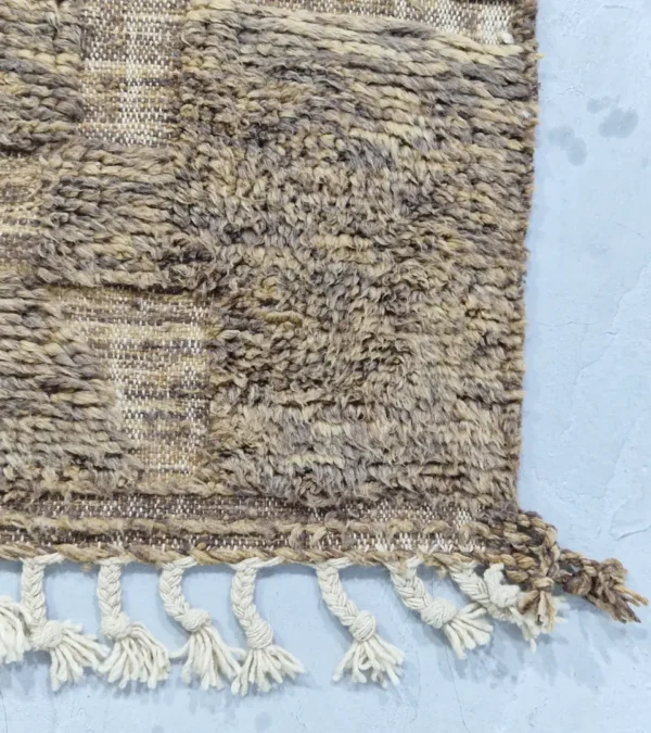 detailed view of Handwoven earth gray wool rug with subtle geometric grid pattern