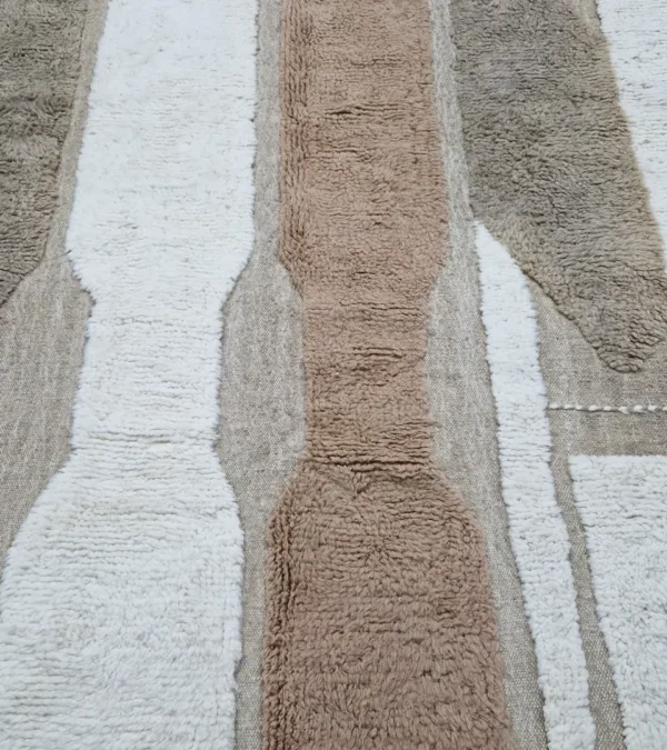 detailed view of Earth tone striped Moroccan rug in beige, taupe, and ivory